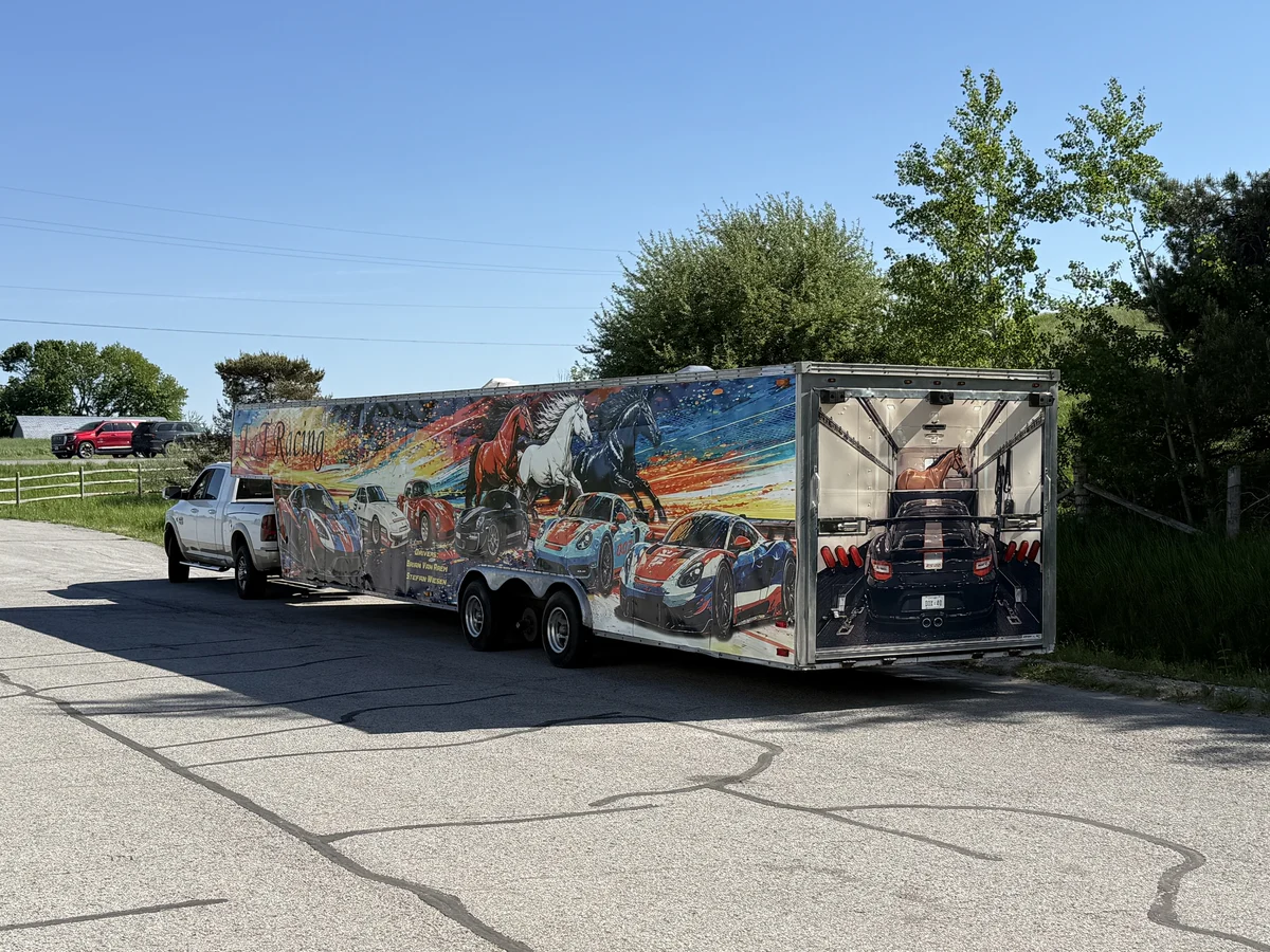 T and T Racing’s colourful trailer beside a white pickup truck